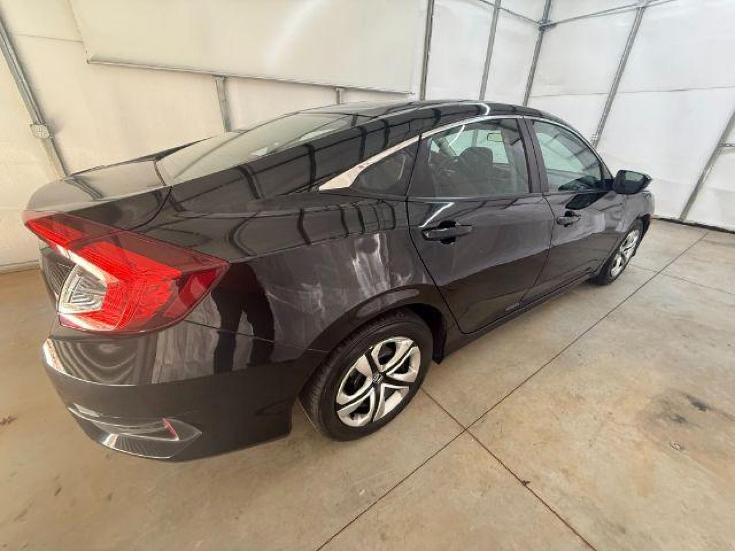 2017 Black Honda Civic LX (19XFC2F56HE) with an 2L I-4 DOHC engine, located at 1806 Veterans Memorial Hwy SW, Austell, GA, 30168, (770) 944-9558, 33.817959, -84.606987 - Photo#6