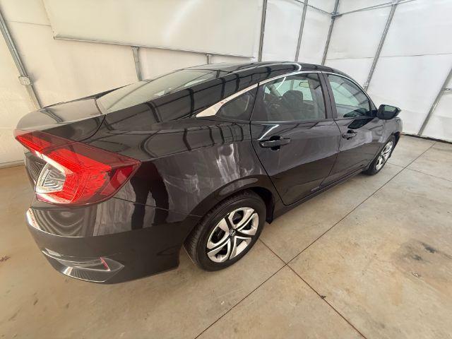 2017 Black Honda Civic LX (19XFC2F56HE) with an 2L I-4 DOHC engine, located at 1806 Veterans Memorial Hwy SW, Austell, GA, 30168, (770) 944-9558, 33.817959, -84.606987 - Photo#6