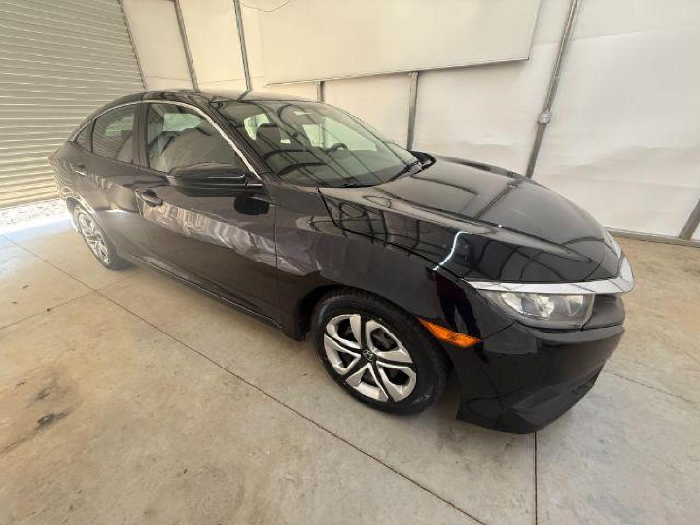 2017 Black Honda Civic LX (19XFC2F56HE) with an 2L I-4 DOHC engine, located at 1806 Veterans Memorial Hwy SW, Austell, GA, 30168, (770) 944-9558, 33.817959, -84.606987 - Photo#7