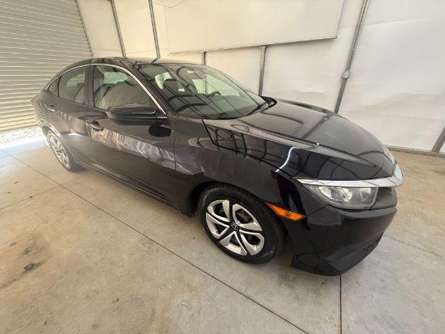 2017 Black Honda Civic LX (19XFC2F56HE) with an 2L I-4 DOHC engine, located at 1806 Veterans Memorial Hwy SW, Austell, GA, 30168, (770) 944-9558, 33.817959, -84.606987 - Photo#7