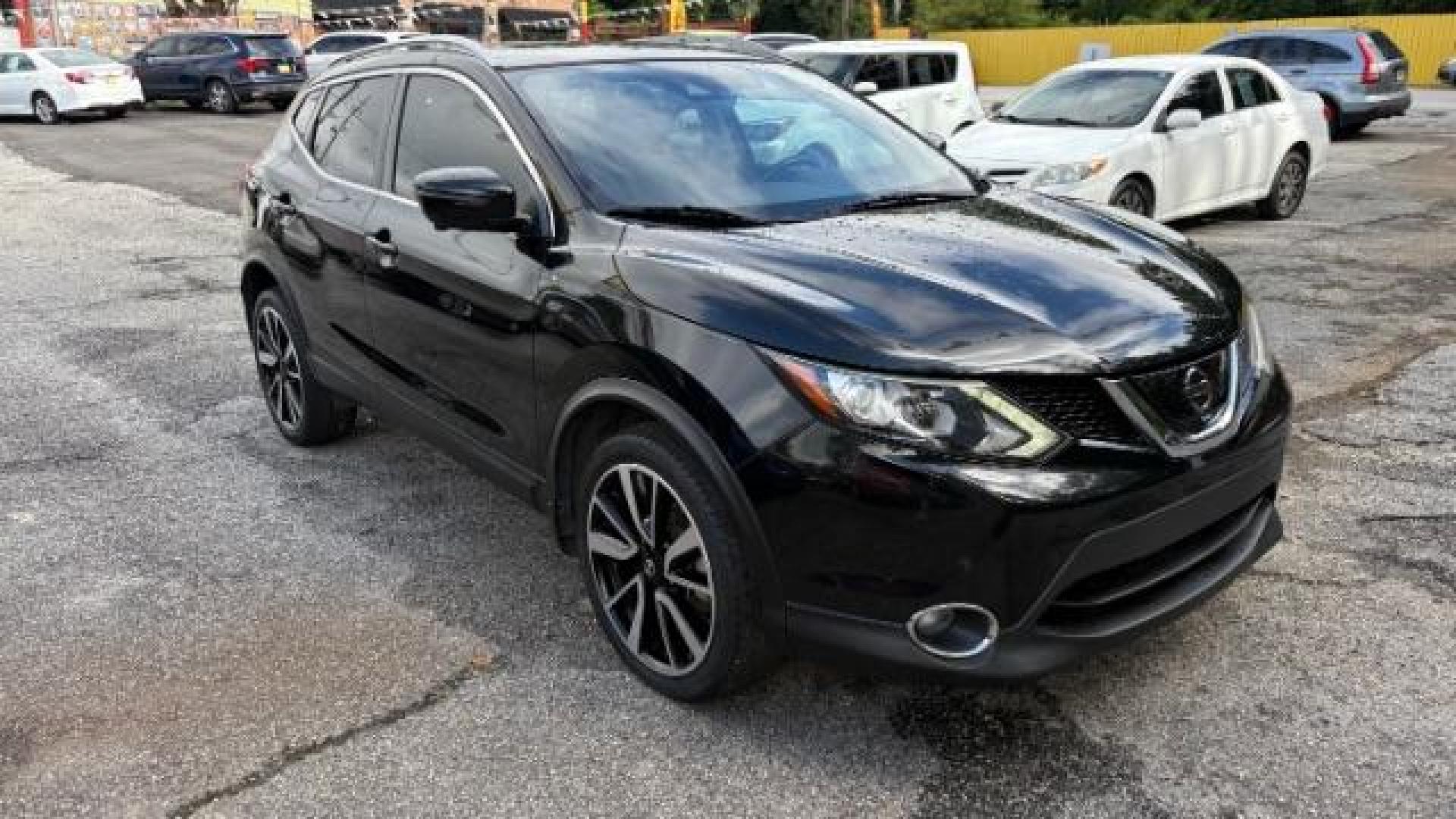 2017 Black Nissan Rogue Sport SL (JN1BJ1CP1HW) with an 2L I-4 gasoline direct injection engine, located at 1806 Veterans Memorial Hwy SW, Austell, GA, 30168, (770) 944-9558, 33.817959, -84.606987 - Photo#4