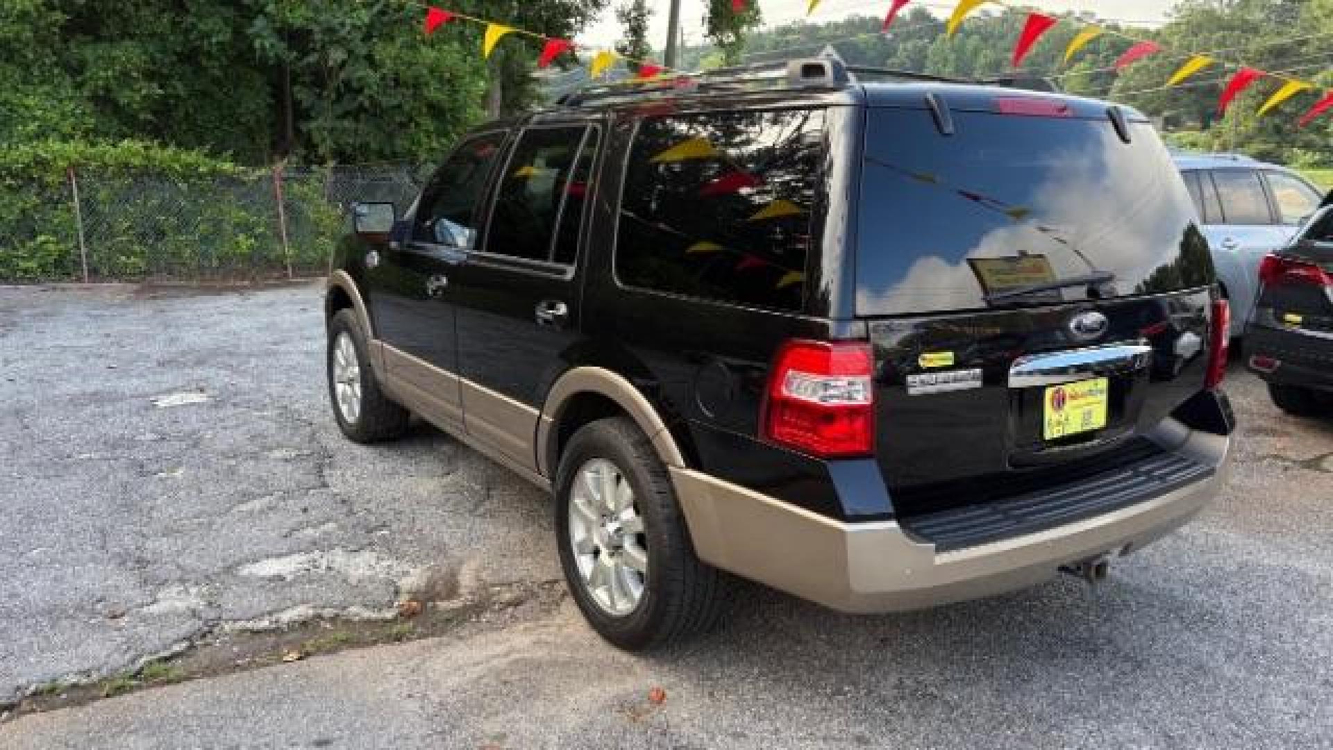 2014 Black Ford Expedition King Ranch (1FMJU1H55EE) with an Triton 5.4L V-8 variable valve control engine, located at 1806 Veterans Memorial Hwy SW, Austell, GA, 30168, (770) 944-9558, 33.817959, -84.606987 - Photo#4