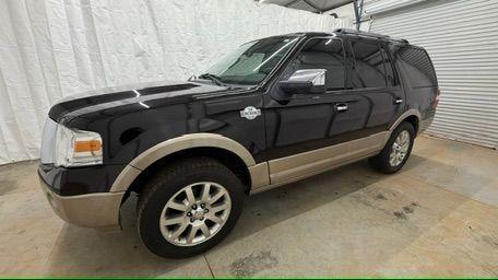 2014 Black Ford Expedition King Ranch (1FMJU1H55EE) with an Triton 5.4L V-8 variable valve control engine, located at 1806 Veterans Memorial Hwy SW, Austell, GA, 30168, (770) 944-9558, 33.817959, -84.606987 - Photo#1