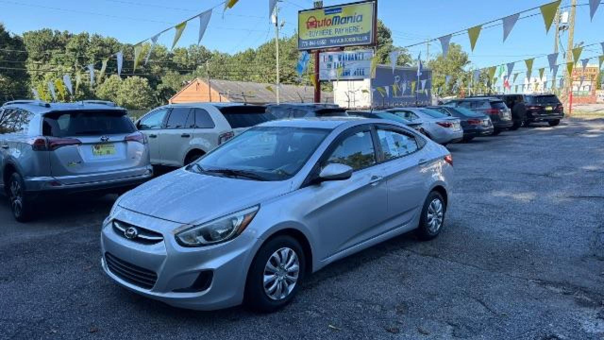 2015 Silver Hyundai Accent GLS (KMHCT4AE8FU) with an 1.6L I-4 gasoline direct injection engine, located at 1806 Veterans Memorial Hwy SW, Austell, GA, 30168, (770) 944-9558, 33.817959, -84.606987 - Photo#0