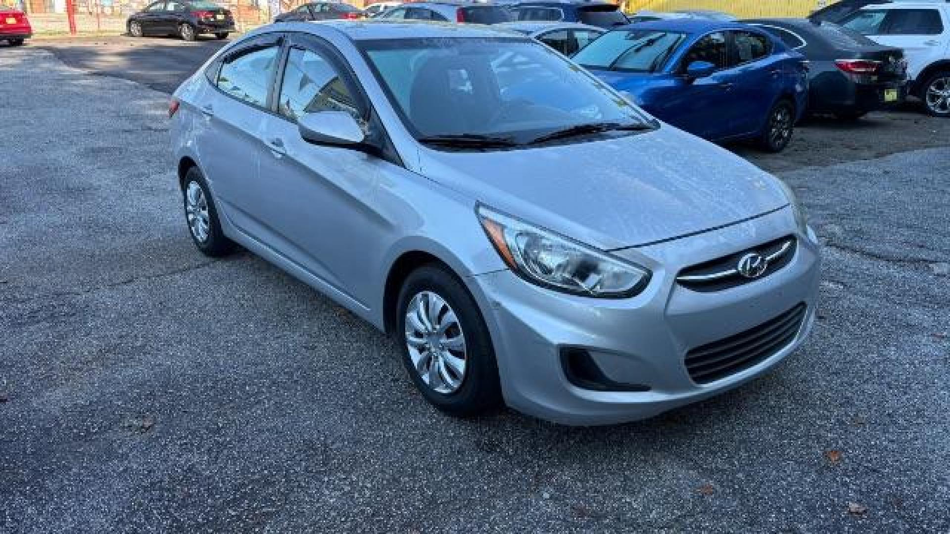2015 Silver Hyundai Accent GLS (KMHCT4AE8FU) with an 1.6L I-4 gasoline direct injection engine, located at 1806 Veterans Memorial Hwy SW, Austell, GA, 30168, (770) 944-9558, 33.817959, -84.606987 - Photo#2