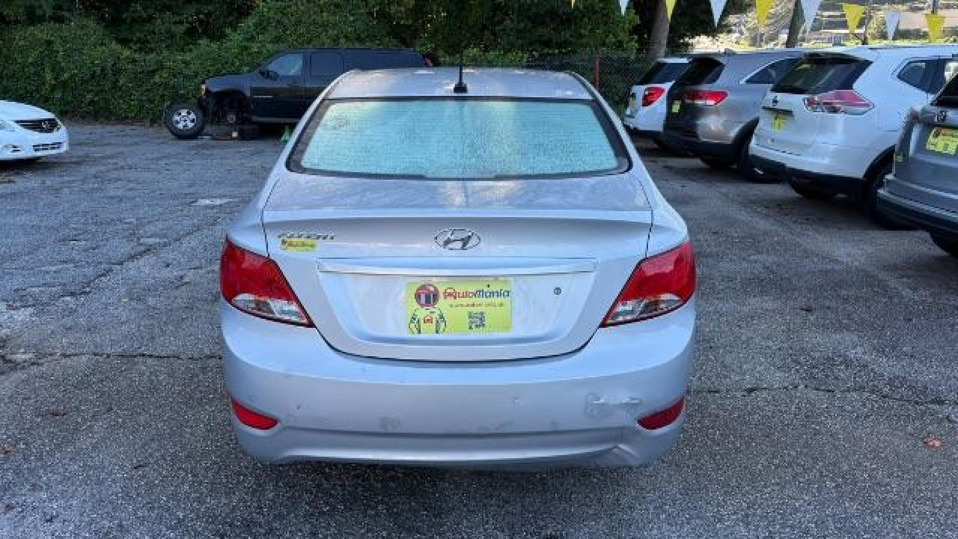 2015 Silver Hyundai Accent GLS (KMHCT4AE8FU) with an 1.6L I-4 gasoline direct injection engine, located at 1806 Veterans Memorial Hwy SW, Austell, GA, 30168, (770) 944-9558, 33.817959, -84.606987 - Photo#4