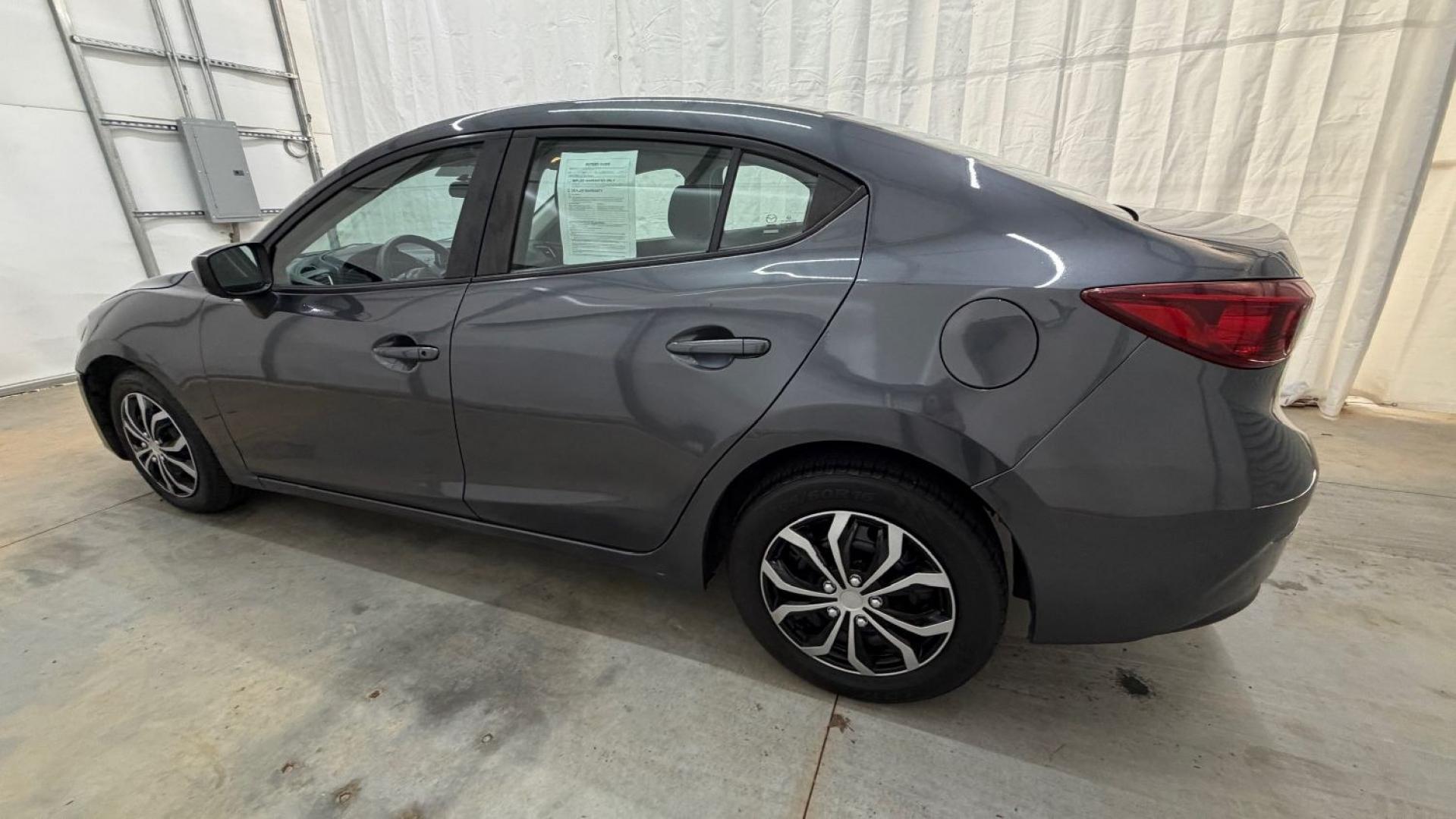 2014 Gray Mazda Mazda3 i Sport (JM1BM1U76E1) with an SKYACTIV-G 2L I-4 ga engine, located at 1806 Veterans Memorial Hwy SW, Austell, GA, 30168, (770) 944-9558, 33.817959, -84.606987- Photo#2