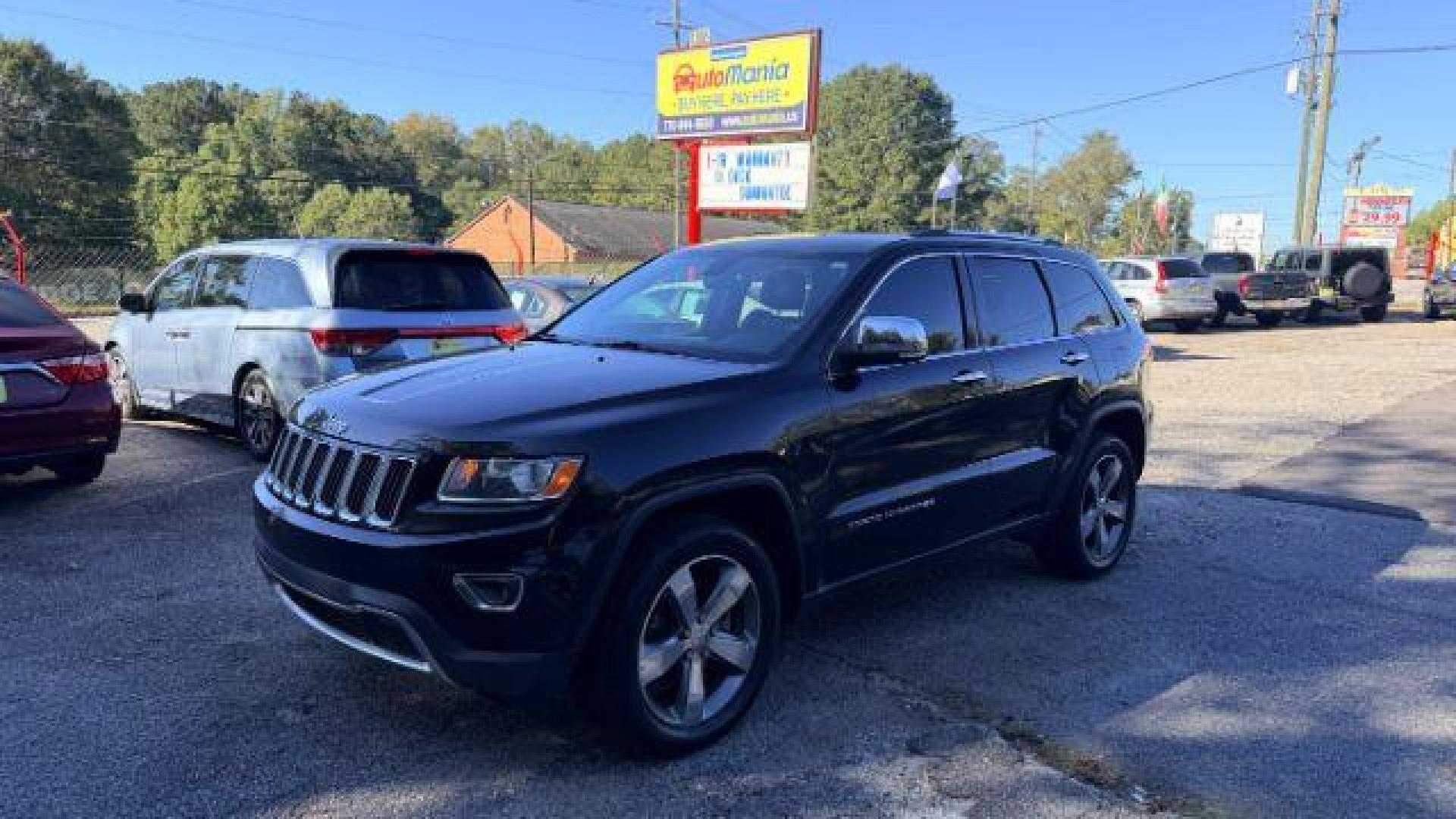 2015 Black Jeep Grand Cherokee Limited 2WD (1C4RJEBG4FC) with an 3.6L V6 DOHC 24V engine, 8-Speed Automatic transmission, located at 1806 Veterans Memorial Hwy SW, Austell, GA, 30168, (770) 944-9558, 33.817959, -84.606987 - Photo#0