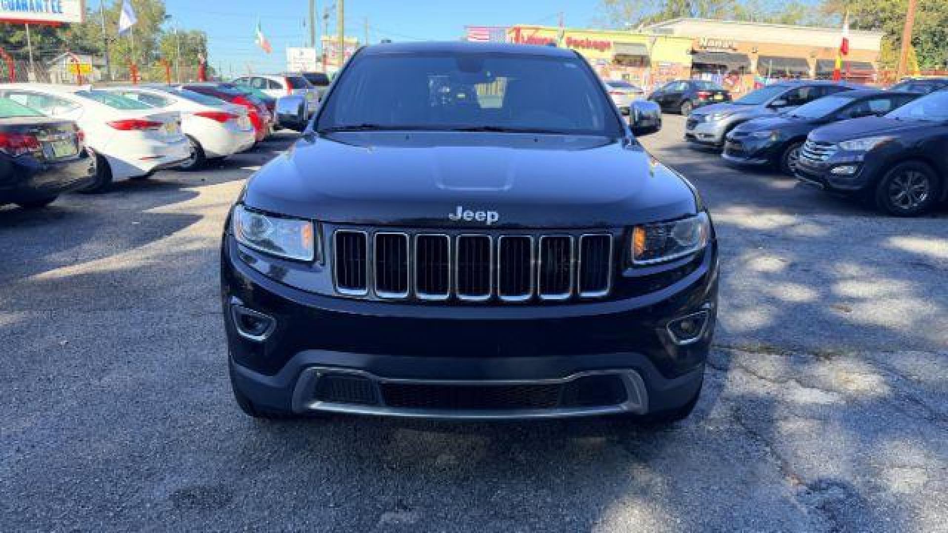 2015 Black Jeep Grand Cherokee Limited 2WD (1C4RJEBG4FC) with an 3.6L V6 DOHC 24V engine, 8-Speed Automatic transmission, located at 1806 Veterans Memorial Hwy SW, Austell, GA, 30168, (770) 944-9558, 33.817959, -84.606987 - Photo#1