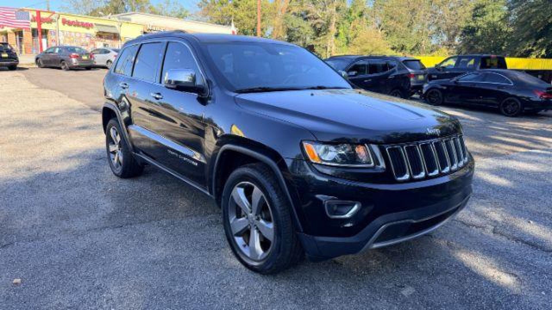 2015 Black Jeep Grand Cherokee Limited 2WD (1C4RJEBG4FC) with an 3.6L V6 DOHC 24V engine, 8-Speed Automatic transmission, located at 1806 Veterans Memorial Hwy SW, Austell, GA, 30168, (770) 944-9558, 33.817959, -84.606987 - Photo#2