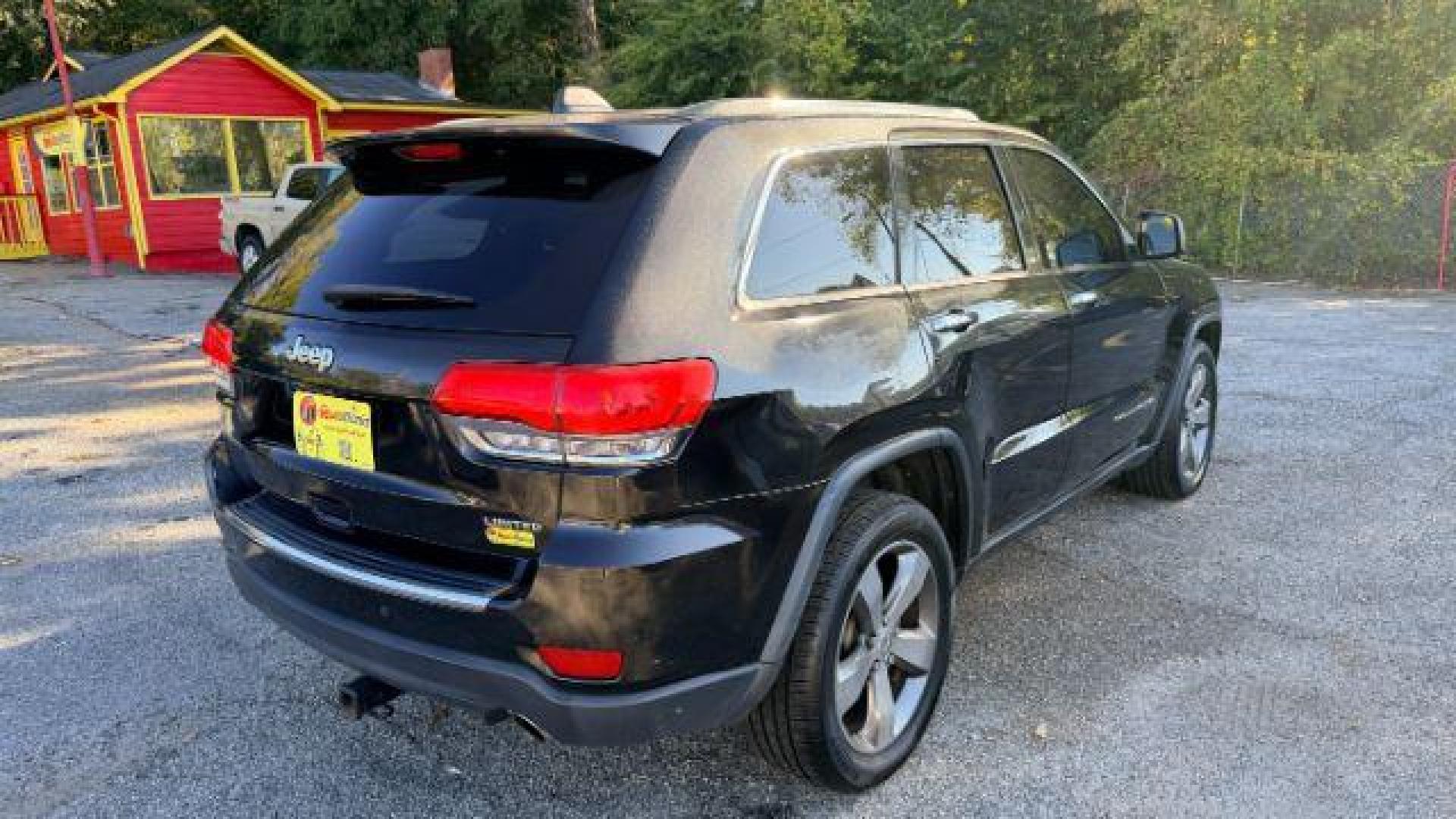 2015 Black Jeep Grand Cherokee Limited 2WD (1C4RJEBG4FC) with an 3.6L V6 DOHC 24V engine, 8-Speed Automatic transmission, located at 1806 Veterans Memorial Hwy SW, Austell, GA, 30168, (770) 944-9558, 33.817959, -84.606987 - Photo#3