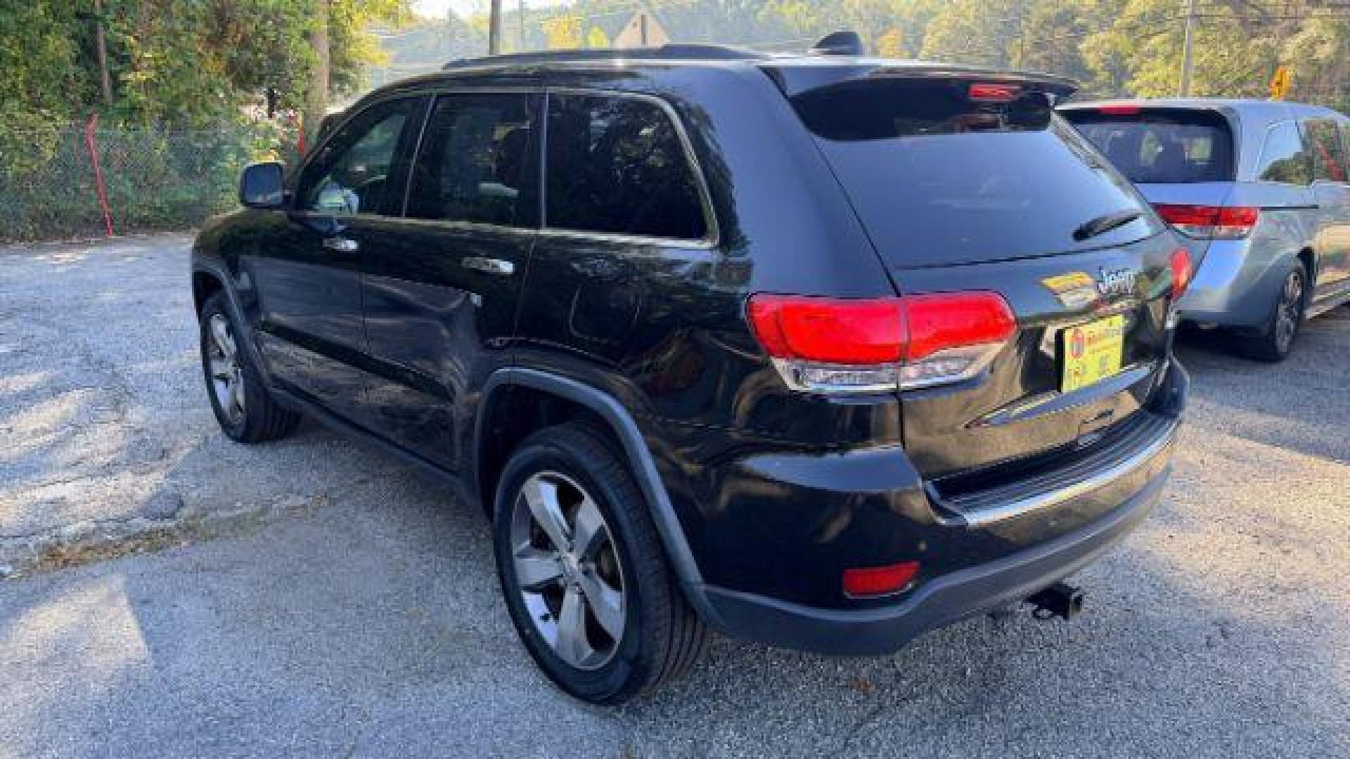 2015 Black Jeep Grand Cherokee Limited 2WD (1C4RJEBG4FC) with an 3.6L V6 DOHC 24V engine, 8-Speed Automatic transmission, located at 1806 Veterans Memorial Hwy SW, Austell, GA, 30168, (770) 944-9558, 33.817959, -84.606987 - Photo#5