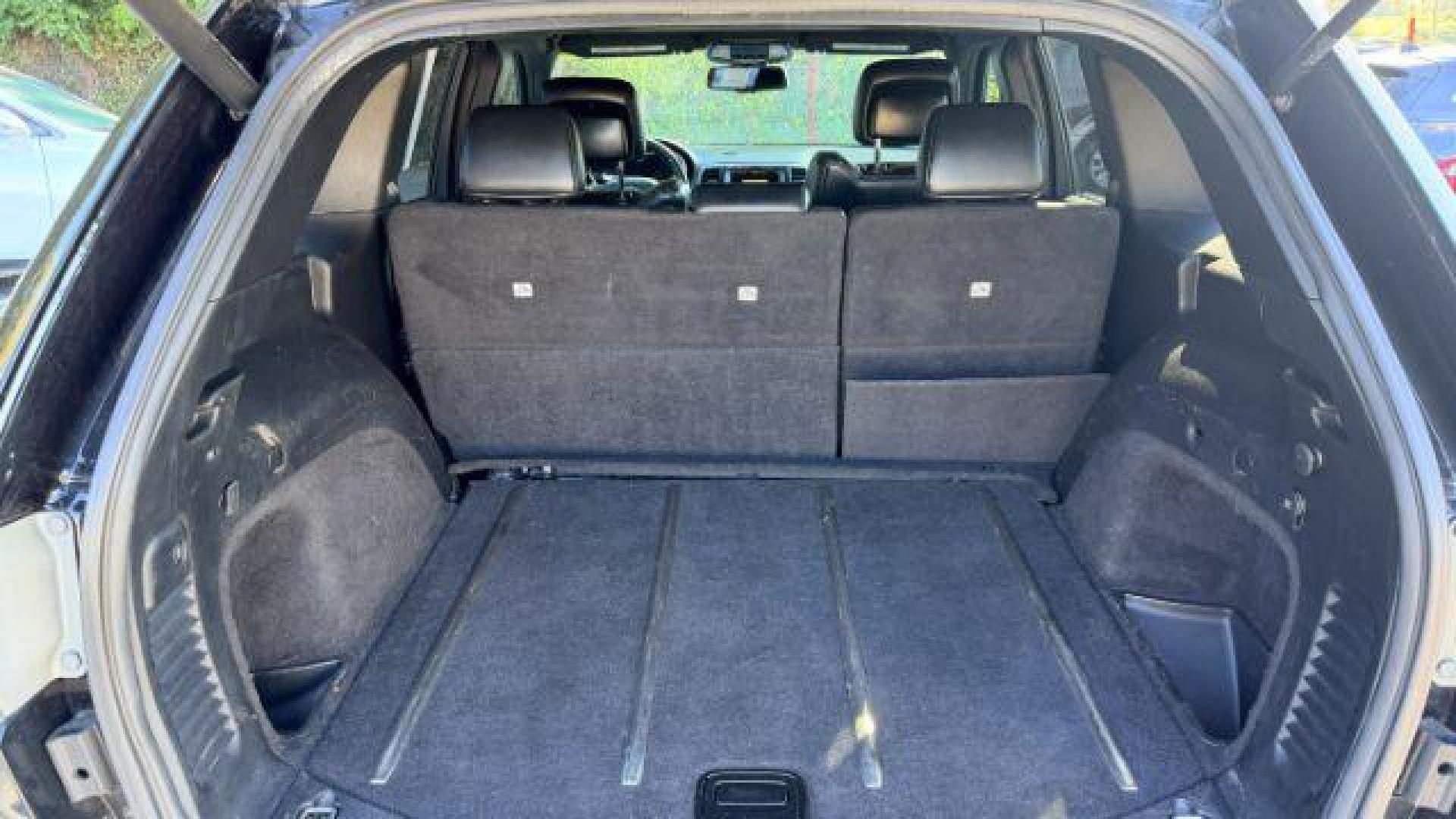 2015 Black Jeep Grand Cherokee Limited 2WD (1C4RJEBG4FC) with an 3.6L V6 DOHC 24V engine, 8-Speed Automatic transmission, located at 1806 Veterans Memorial Hwy SW, Austell, GA, 30168, (770) 944-9558, 33.817959, -84.606987 - Photo#6