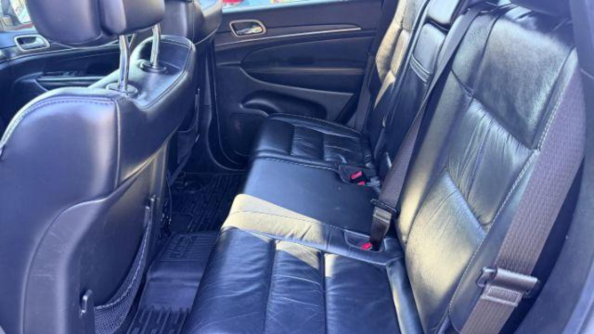 2015 Black Jeep Grand Cherokee Limited 2WD (1C4RJEBG4FC) with an 3.6L V6 DOHC 24V engine, 8-Speed Automatic transmission, located at 1806 Veterans Memorial Hwy SW, Austell, GA, 30168, (770) 944-9558, 33.817959, -84.606987 - Photo#7