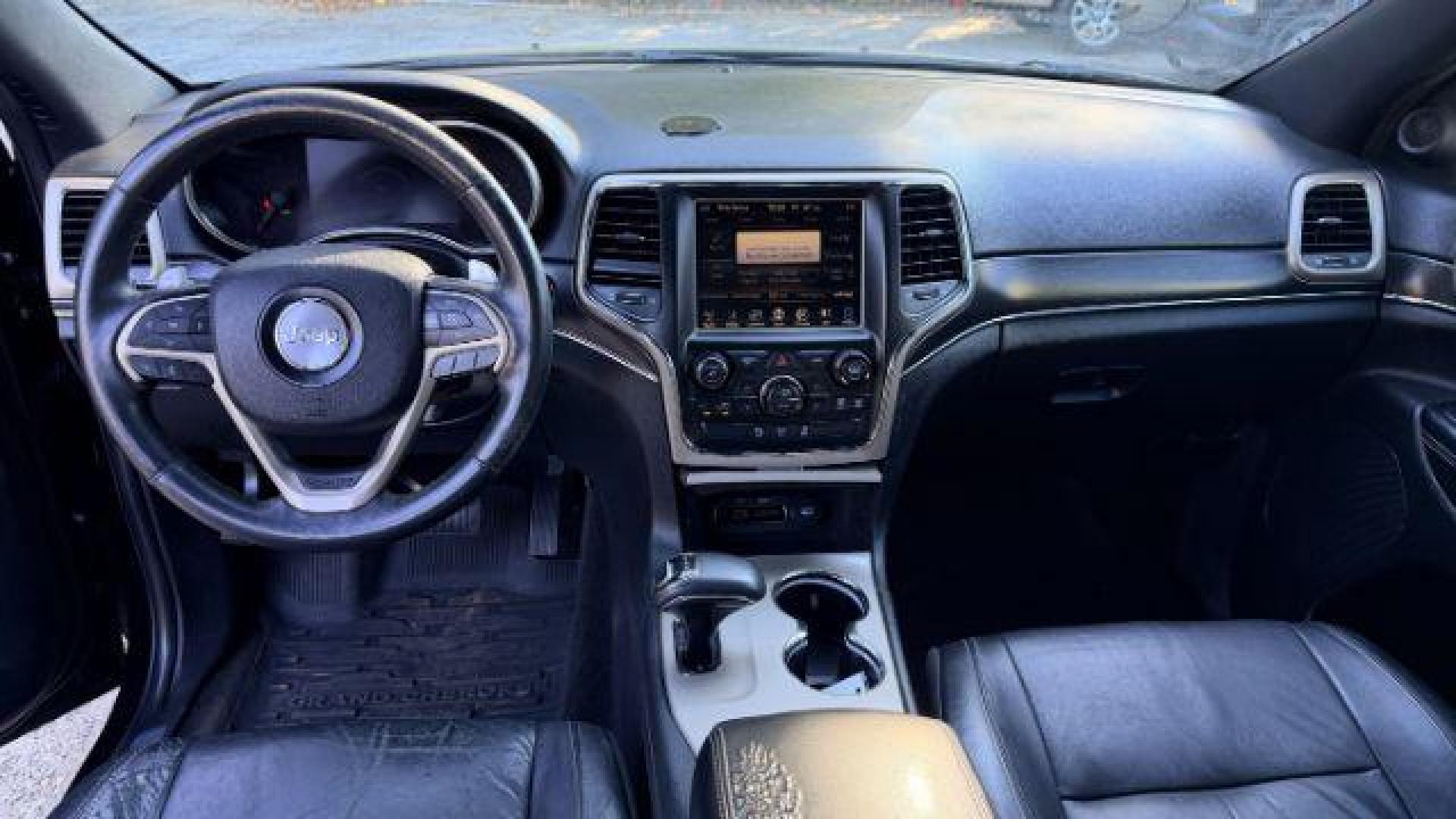 2015 Black Jeep Grand Cherokee Limited 2WD (1C4RJEBG4FC) with an 3.6L V6 DOHC 24V engine, 8-Speed Automatic transmission, located at 1806 Veterans Memorial Hwy SW, Austell, GA, 30168, (770) 944-9558, 33.817959, -84.606987 - Photo#11