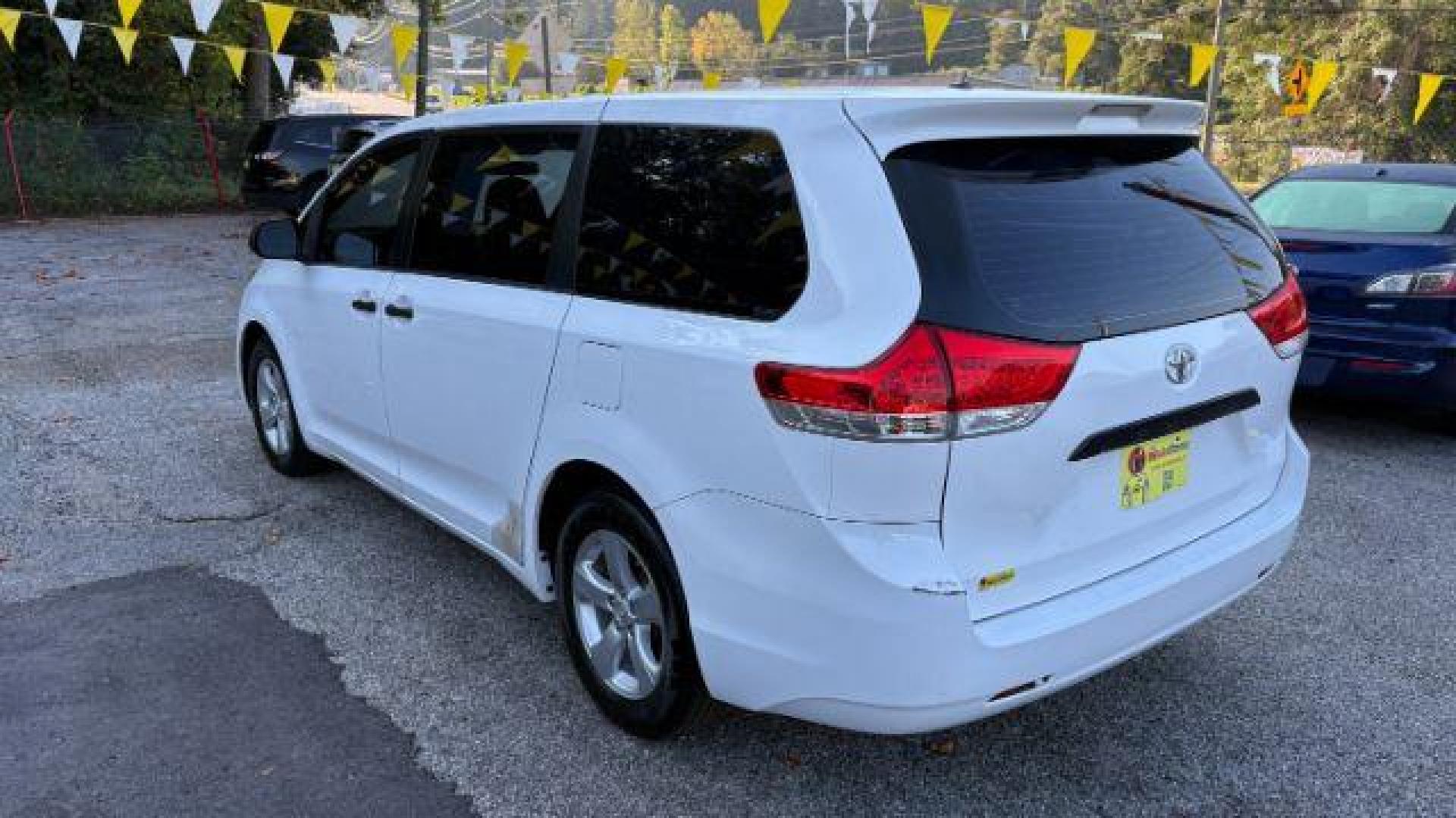 2014 White Toyota Sienna L V6 7 Passenger (5TDZK3DC3ES) with an 3.5L V-6 DOHC engine, located at 1806 Veterans Memorial Hwy SW, Austell, GA, 30168, (770) 944-9558, 33.817959, -84.606987 - Photo#7