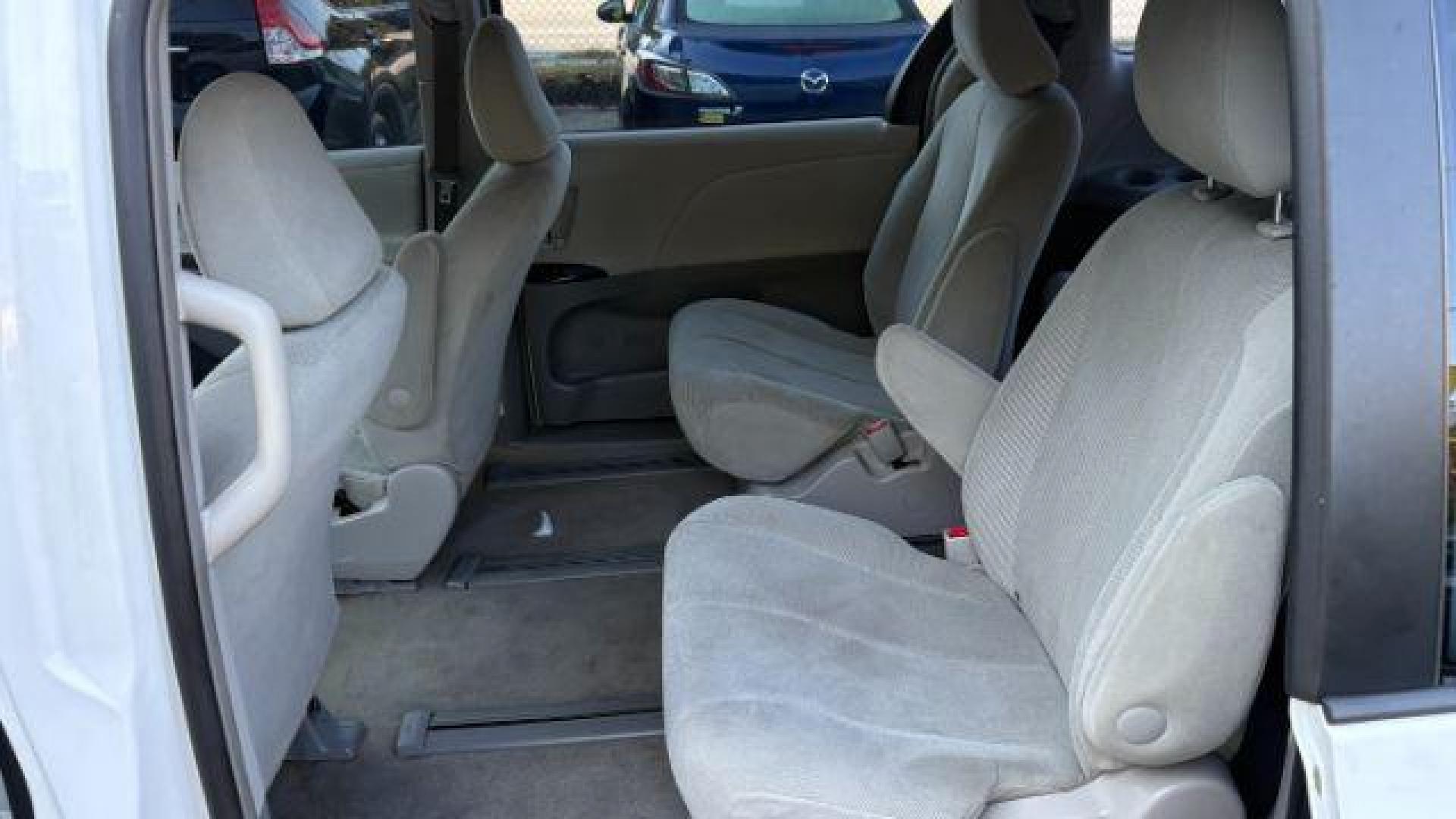 2014 White Toyota Sienna L V6 7 Passenger (5TDZK3DC3ES) with an 3.5L V-6 DOHC engine, located at 1806 Veterans Memorial Hwy SW, Austell, GA, 30168, (770) 944-9558, 33.817959, -84.606987 - Photo#8