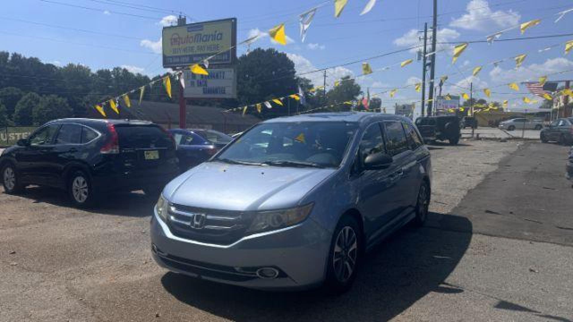 2014 Blue Honda Odyssey Touring | Touring Elite (5FNRL5H99EB) with an 3.5L V-6 i-VTEC variable valve control engine, located at 1806 Veterans Memorial Hwy SW, Austell, GA, 30168, (770) 944-9558, 33.817959, -84.606987 - Photo#0