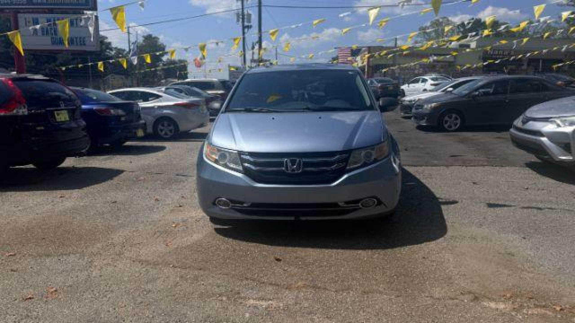 2014 Blue Honda Odyssey Touring | Touring Elite (5FNRL5H99EB) with an 3.5L V-6 i-VTEC variable valve control engine, located at 1806 Veterans Memorial Hwy SW, Austell, GA, 30168, (770) 944-9558, 33.817959, -84.606987 - Photo#1