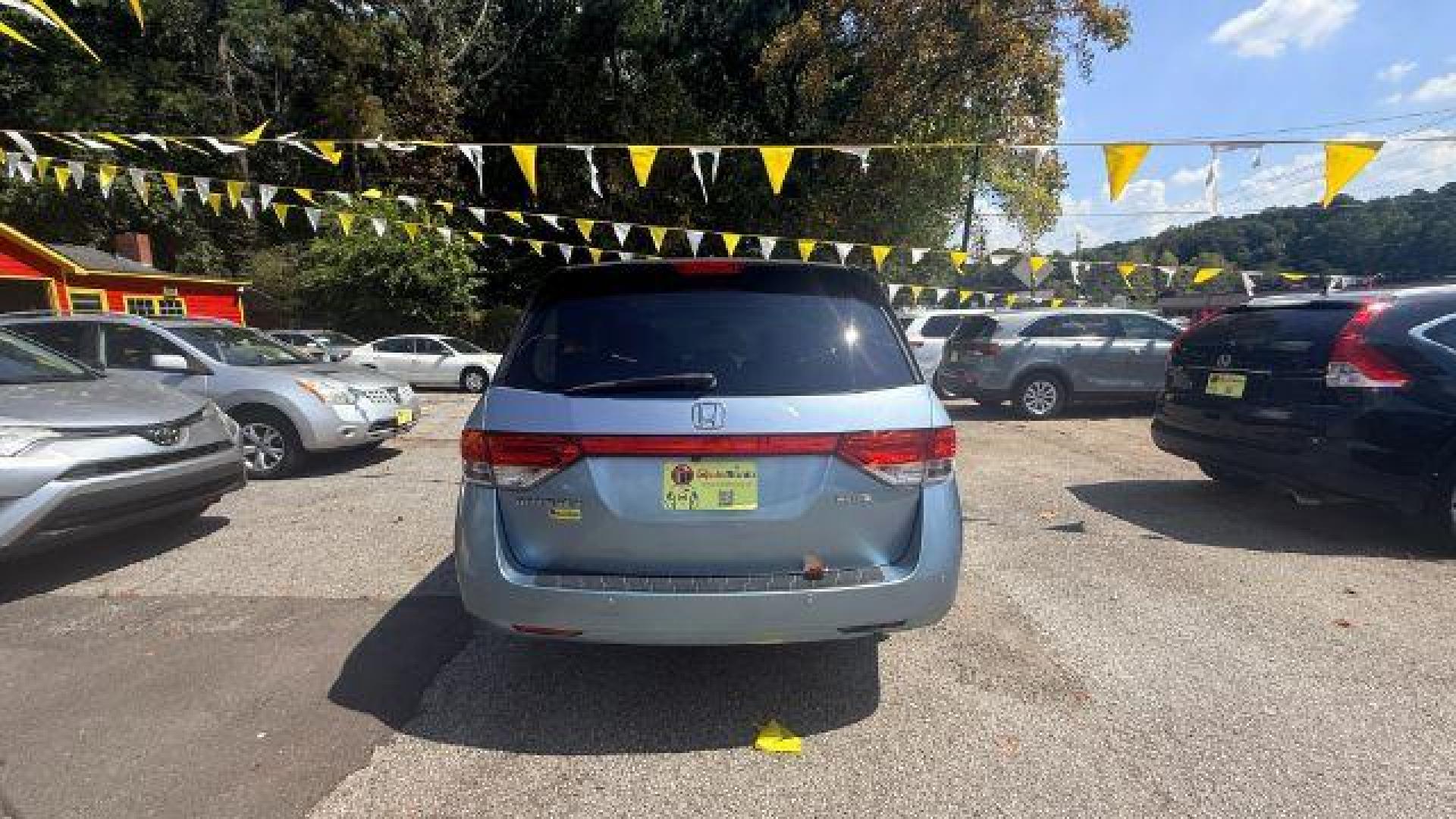 2014 Blue Honda Odyssey Touring | Touring Elite (5FNRL5H99EB) with an 3.5L V-6 i-VTEC variable valve control engine, located at 1806 Veterans Memorial Hwy SW, Austell, GA, 30168, (770) 944-9558, 33.817959, -84.606987 - Photo#3