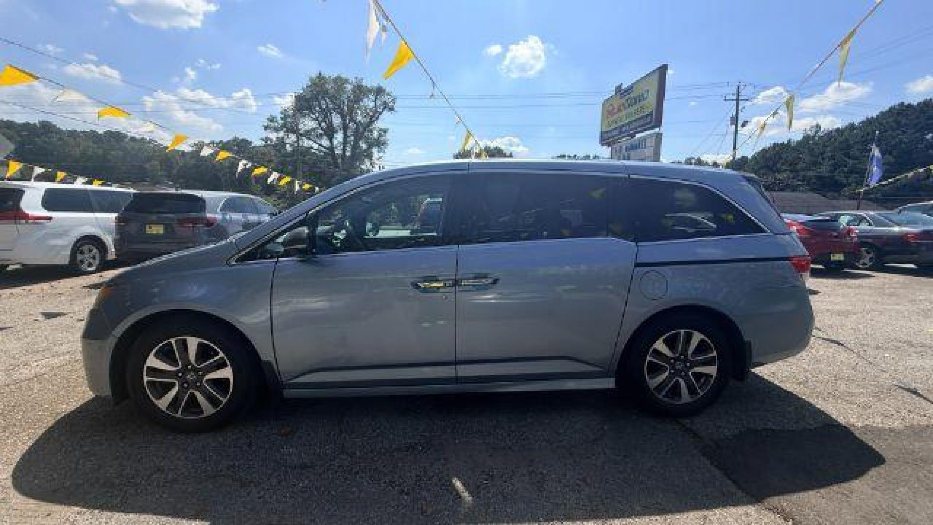 2014 Blue Honda Odyssey Touring | Touring Elite (5FNRL5H99EB) with an 3.5L V-6 i-VTEC variable valve control engine, located at 1806 Veterans Memorial Hwy SW, Austell, GA, 30168, (770) 944-9558, 33.817959, -84.606987 - Photo#4