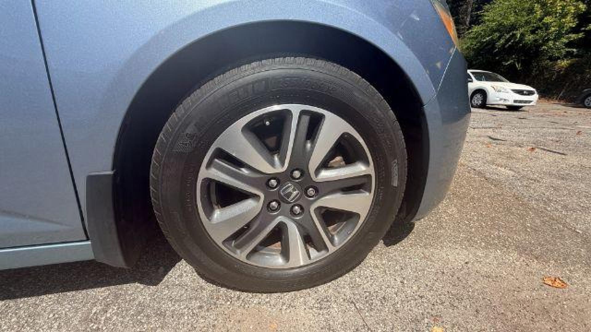 2014 Blue Honda Odyssey Touring | Touring Elite (5FNRL5H99EB) with an 3.5L V-6 i-VTEC variable valve control engine, located at 1806 Veterans Memorial Hwy SW, Austell, GA, 30168, (770) 944-9558, 33.817959, -84.606987 - Photo#28