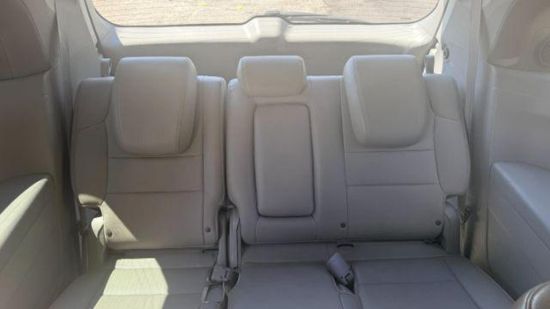 2014 Blue Honda Odyssey Touring | Touring Elite (5FNRL5H99EB) with an 3.5L V-6 i-VTEC variable valve control engine, located at 1806 Veterans Memorial Hwy SW, Austell, GA, 30168, (770) 944-9558, 33.817959, -84.606987 - Photo#5