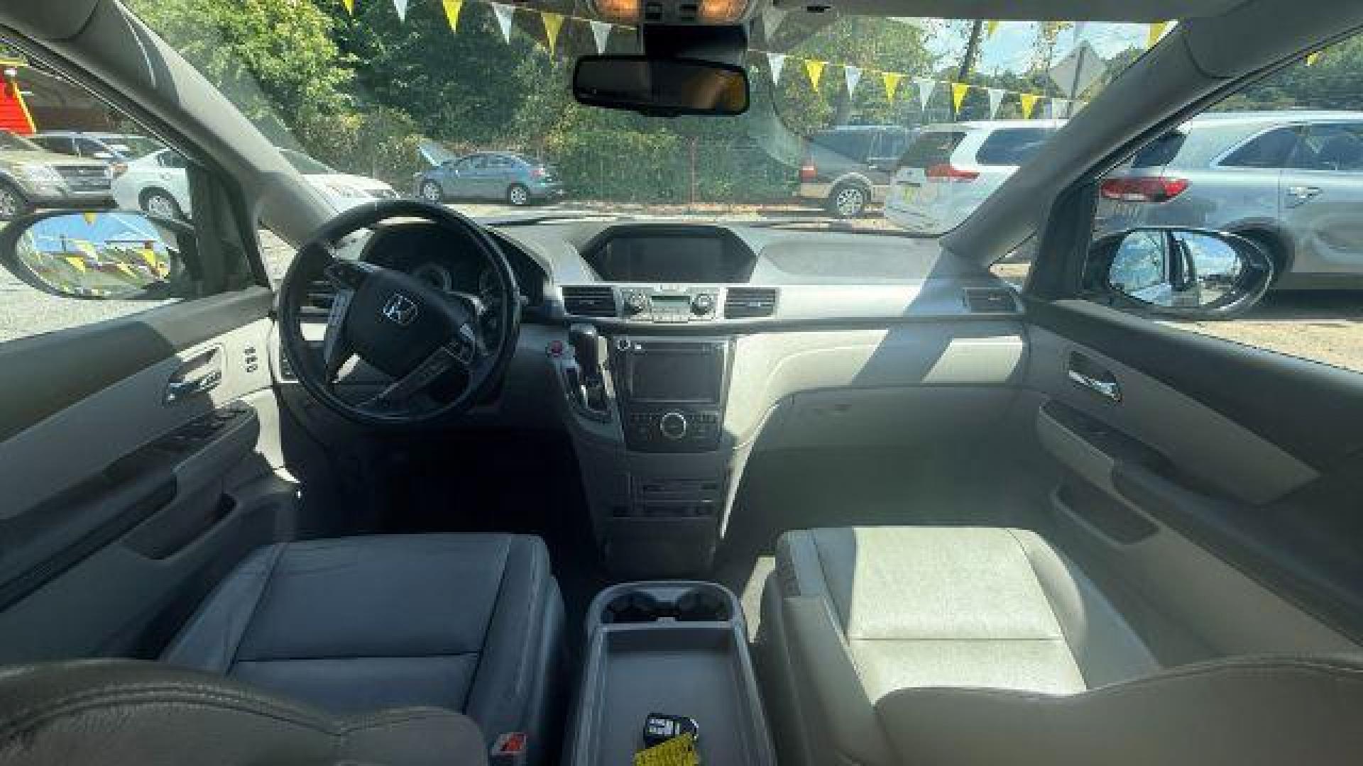 2014 Blue Honda Odyssey Touring | Touring Elite (5FNRL5H99EB) with an 3.5L V-6 i-VTEC variable valve control engine, located at 1806 Veterans Memorial Hwy SW, Austell, GA, 30168, (770) 944-9558, 33.817959, -84.606987 - Photo#8