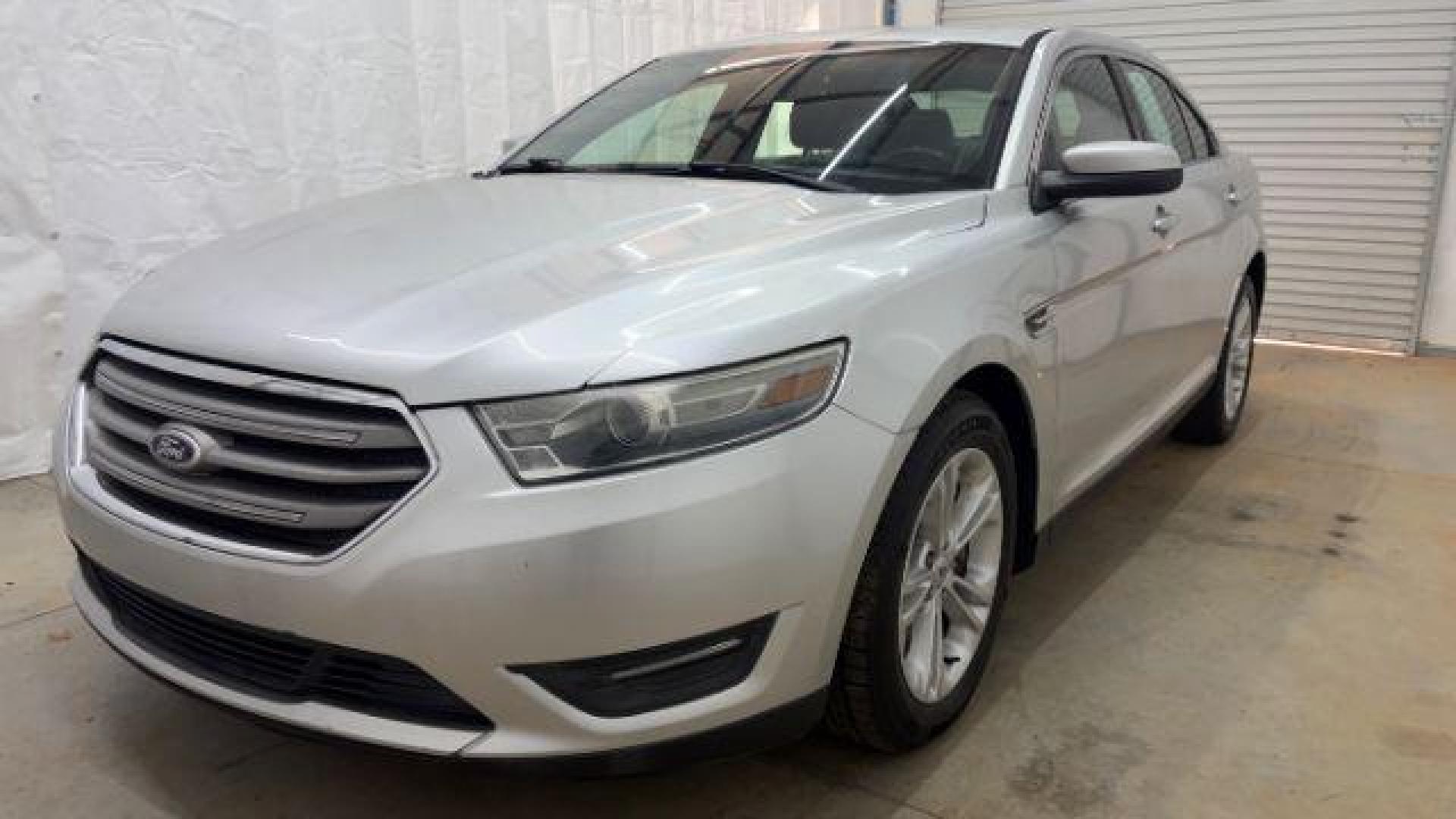 2013 Silver Ford Taurus SEL (1FAHP2E84DG) with an EcoBoost 2L I-4 gasoline direct injection engine, located at 1806 Veterans Memorial Hwy SW, Austell, GA, 30168, (770) 944-9558, 33.817959, -84.606987 - Photo#0