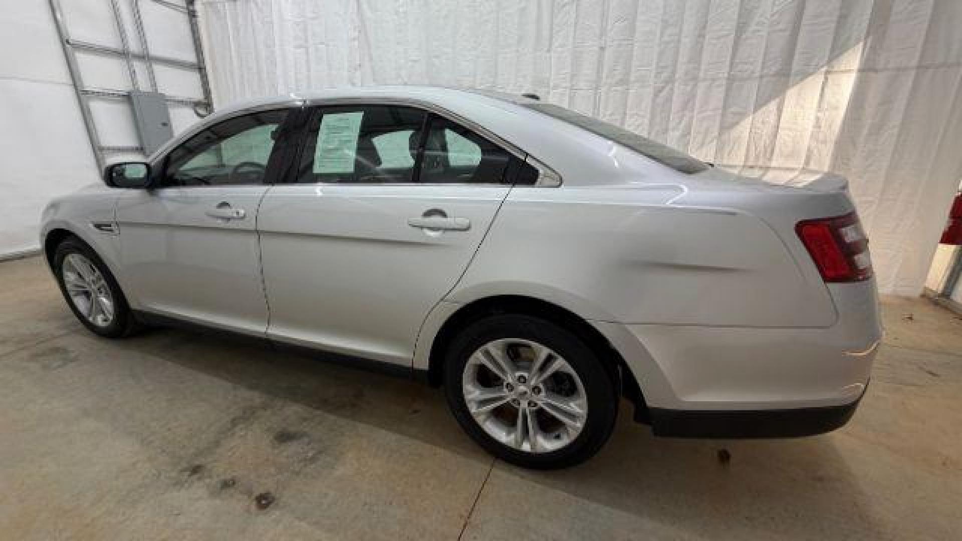 2013 Silver Ford Taurus SEL (1FAHP2E84DG) with an EcoBoost 2L I-4 gasoline direct injection engine, located at 1806 Veterans Memorial Hwy SW, Austell, GA, 30168, (770) 944-9558, 33.817959, -84.606987 - Photo#2