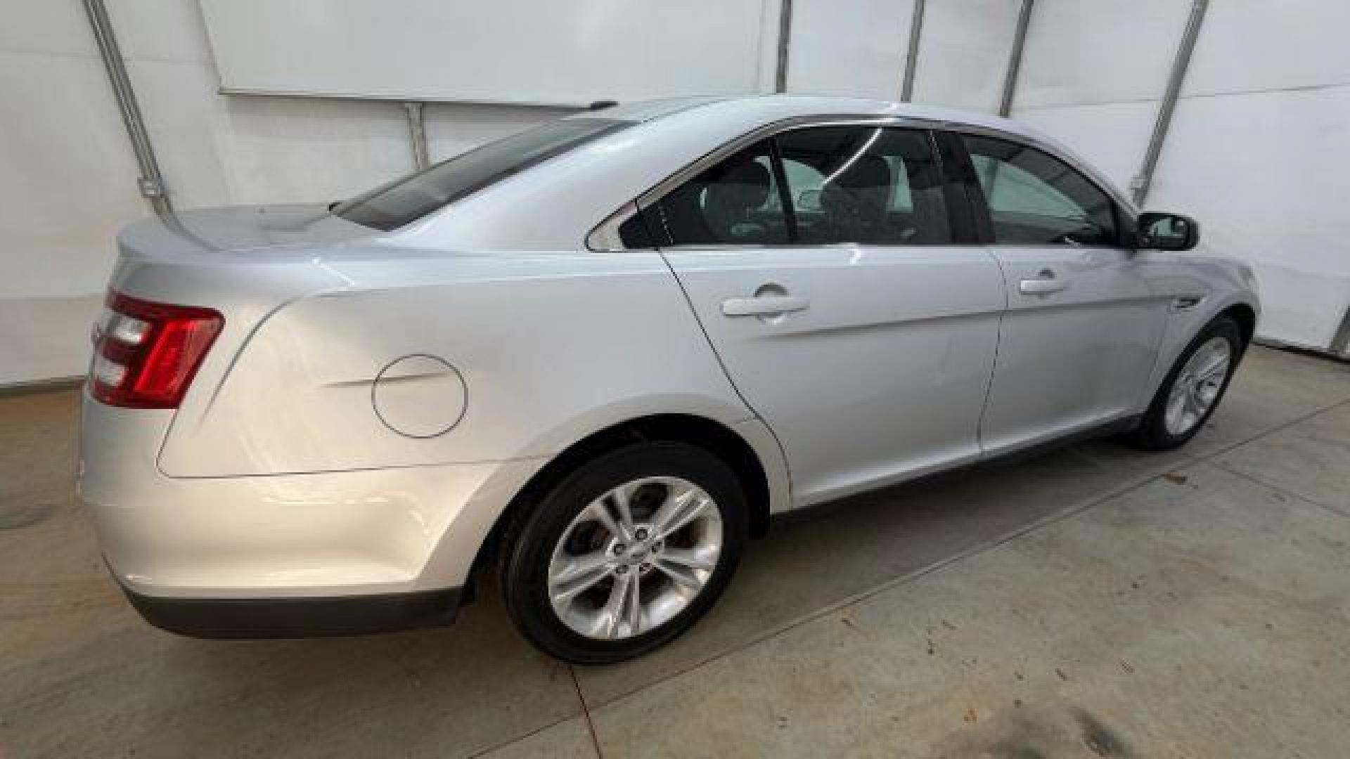 2013 Silver Ford Taurus SEL (1FAHP2E84DG) with an EcoBoost 2L I-4 gasoline direct injection engine, located at 1806 Veterans Memorial Hwy SW, Austell, GA, 30168, (770) 944-9558, 33.817959, -84.606987 - Photo#6