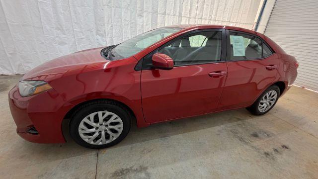 2019 Red Toyota Corolla LE (5YFBURHE6KP) with an 1.8L I-4 DOHC engine, located at 1806 Veterans Memorial Hwy SW, Austell, GA, 30168, (770) 944-9558, 33.817959, -84.606987 - Photo#1