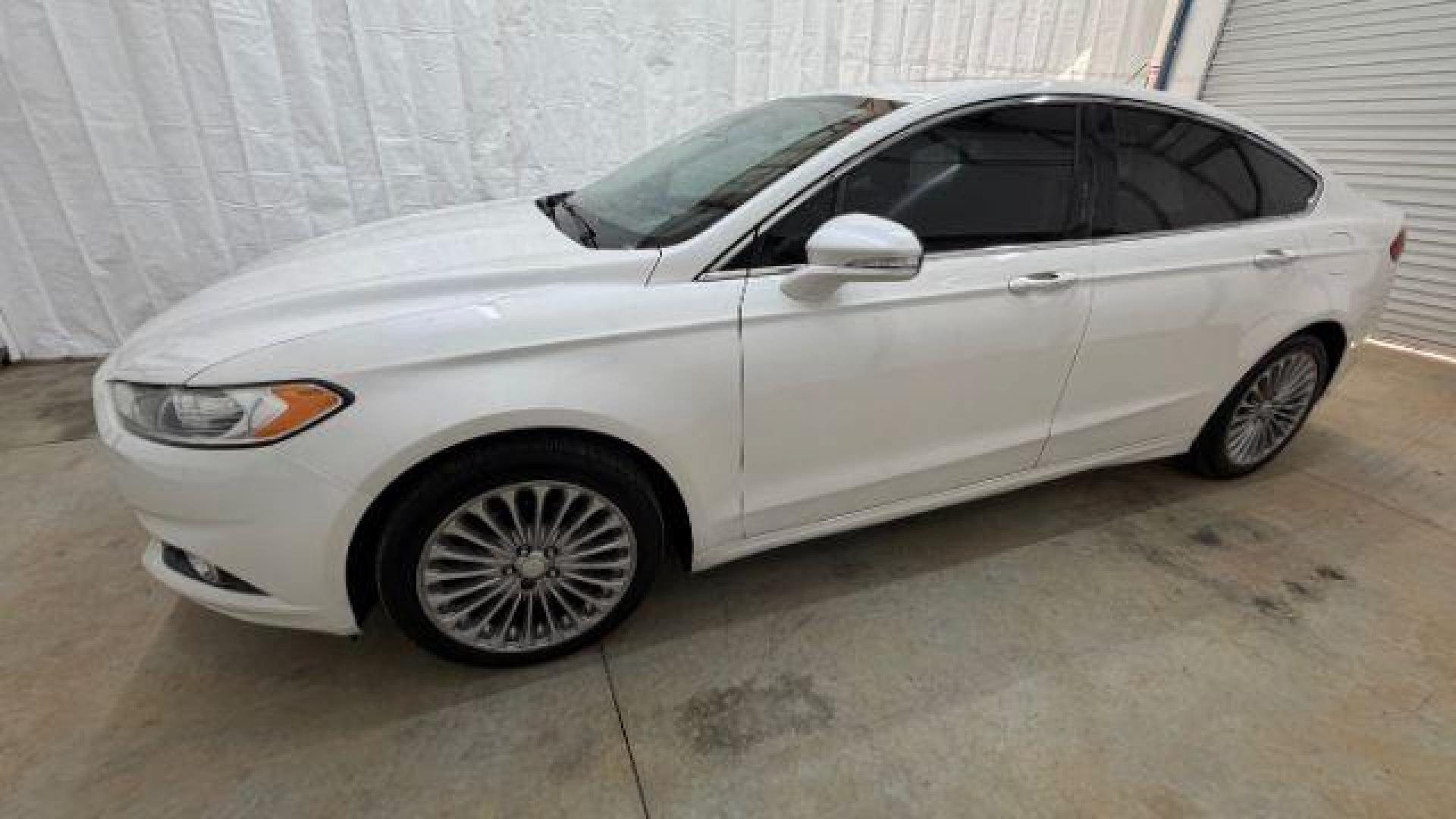 2013 White Ford Fusion Titanium (3FA6P0K98DR) with an EcoBoost 2L I-4 gasoline direct injection engine, located at 1806 Veterans Memorial Hwy SW, Austell, GA, 30168, (770) 944-9558, 33.817959, -84.606987 - Photo#1