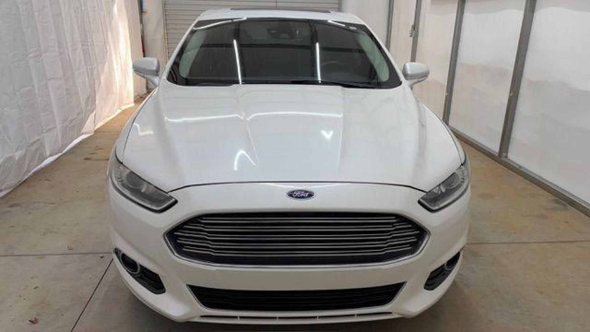 2013 White Ford Fusion Titanium (3FA6P0K98DR) with an EcoBoost 2L I-4 gasoline direct injection engine, located at 1806 Veterans Memorial Hwy SW, Austell, GA, 30168, (770) 944-9558, 33.817959, -84.606987 - Photo#9