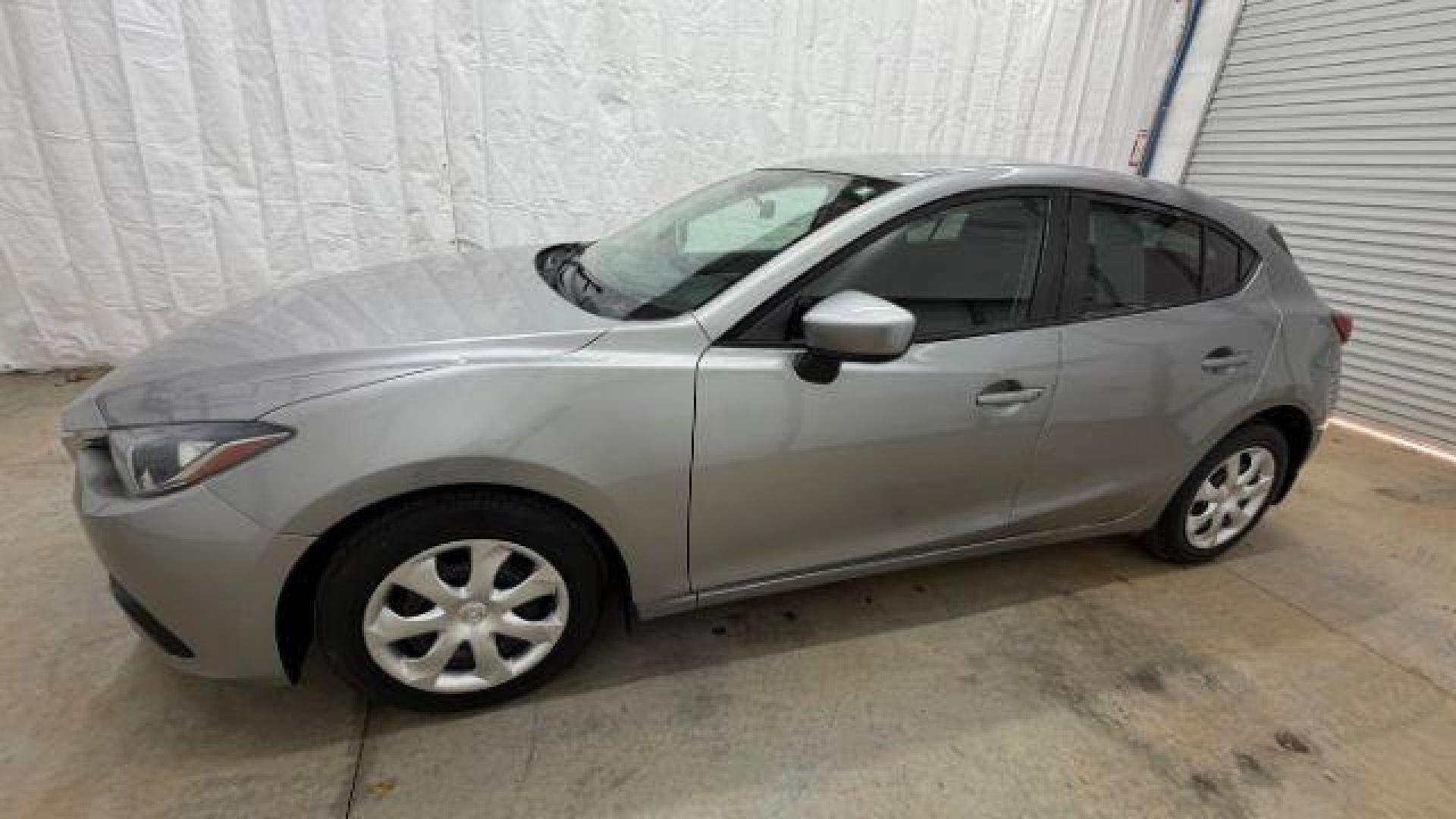 2015 Silver Mazda Mazda3 Hatchback i Sport (3MZBM1K79FM) with an SKYACTIV-G 2L I-4 gasoline direct injection engine, located at 1806 Veterans Memorial Hwy SW, Austell, GA, 30168, (770) 944-9558, 33.817959, -84.606987 - Photo#1