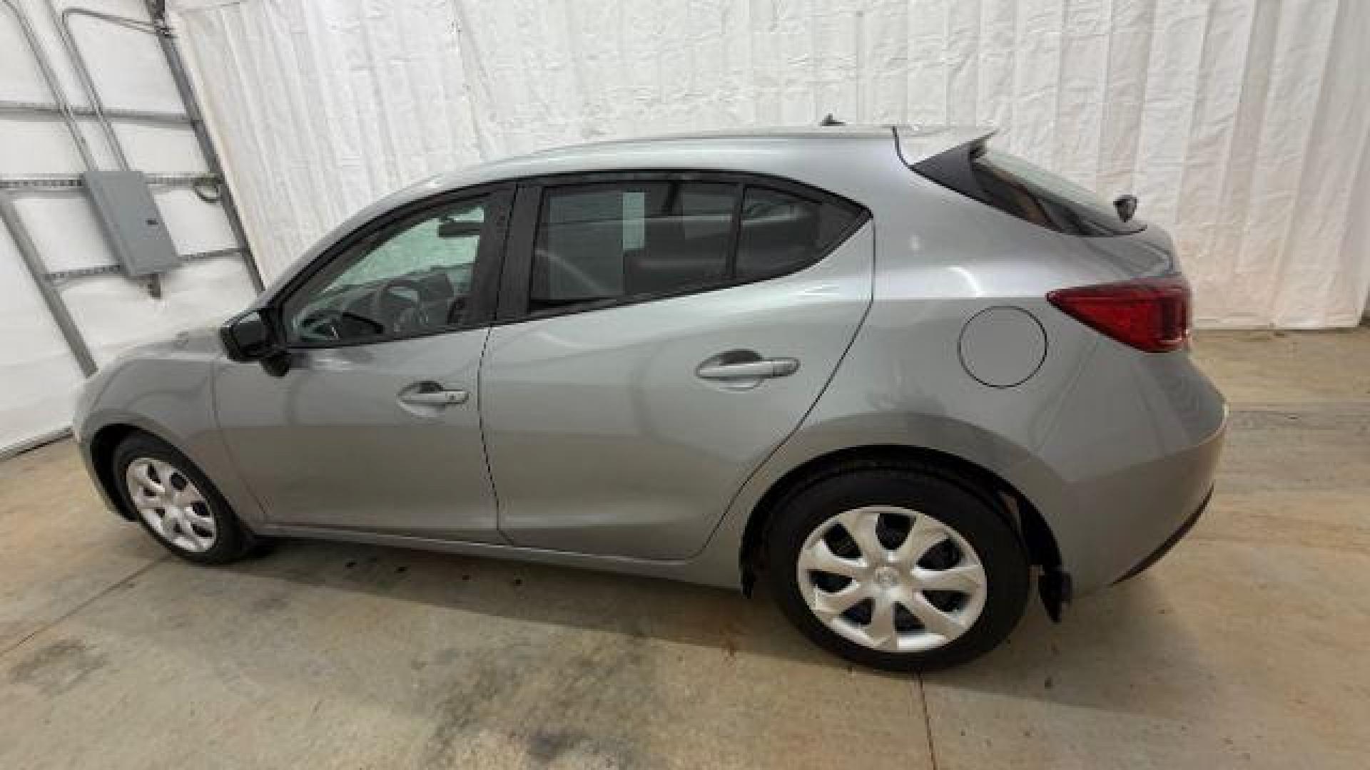 2015 Silver Mazda Mazda3 Hatchback i Sport (3MZBM1K79FM) with an SKYACTIV-G 2L I-4 gasoline direct injection engine, located at 1806 Veterans Memorial Hwy SW, Austell, GA, 30168, (770) 944-9558, 33.817959, -84.606987 - Photo#2