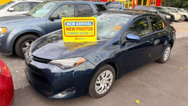 2018 Blue Toyota Corolla LE (5YFBURHE2JP) with an 1.8L I-4 DOHC engine, located at 1806 Veterans Memorial Hwy SW, Austell, GA, 30168, (770) 944-9558, 33.817959, -84.606987 - Photo#0