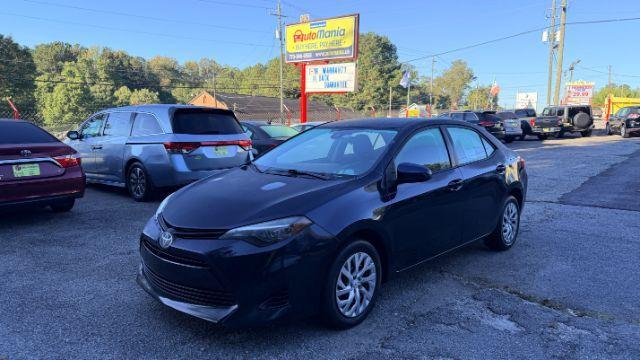 2018 Blue Toyota Corolla LE (5YFBURHE2JP) with an 1.8L I-4 DOHC engine, located at 1806 Veterans Memorial Hwy SW, Austell, GA, 30168, (770) 944-9558, 33.817959, -84.606987 - Photo#1