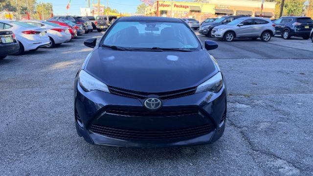 2018 Blue Toyota Corolla LE (5YFBURHE2JP) with an 1.8L I-4 DOHC engine, located at 1806 Veterans Memorial Hwy SW, Austell, GA, 30168, (770) 944-9558, 33.817959, -84.606987 - Photo#2