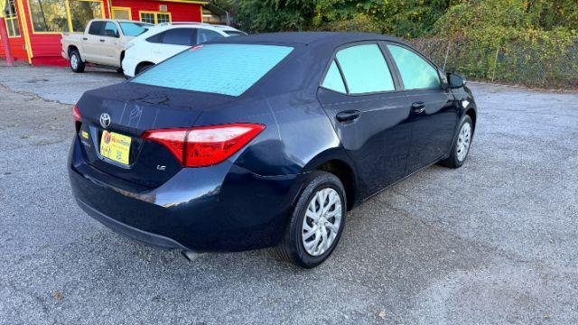 2018 Blue Toyota Corolla LE (5YFBURHE2JP) with an 1.8L I-4 DOHC engine, located at 1806 Veterans Memorial Hwy SW, Austell, GA, 30168, (770) 944-9558, 33.817959, -84.606987 - Photo#4