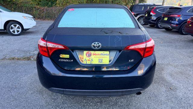 2018 Blue Toyota Corolla LE (5YFBURHE2JP) with an 1.8L I-4 DOHC engine, located at 1806 Veterans Memorial Hwy SW, Austell, GA, 30168, (770) 944-9558, 33.817959, -84.606987 - Photo#5