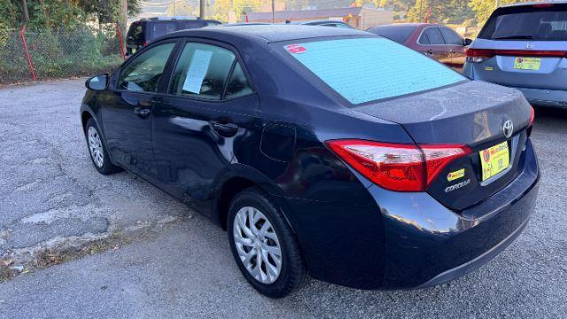 2018 Blue Toyota Corolla LE (5YFBURHE2JP) with an 1.8L I-4 DOHC engine, located at 1806 Veterans Memorial Hwy SW, Austell, GA, 30168, (770) 944-9558, 33.817959, -84.606987 - Photo#6