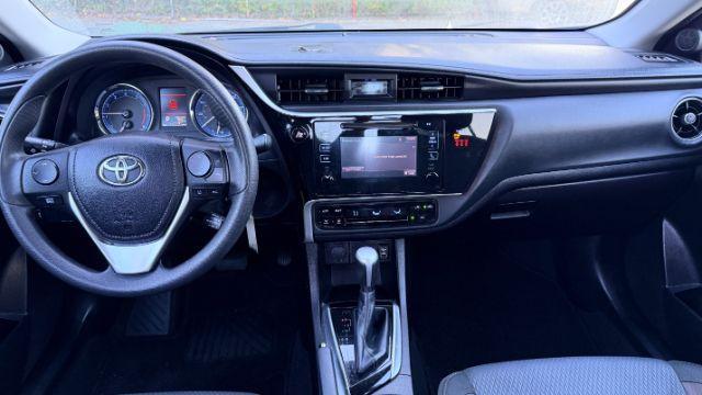 2018 Blue Toyota Corolla LE (5YFBURHE2JP) with an 1.8L I-4 DOHC engine, located at 1806 Veterans Memorial Hwy SW, Austell, GA, 30168, (770) 944-9558, 33.817959, -84.606987 - Photo#8