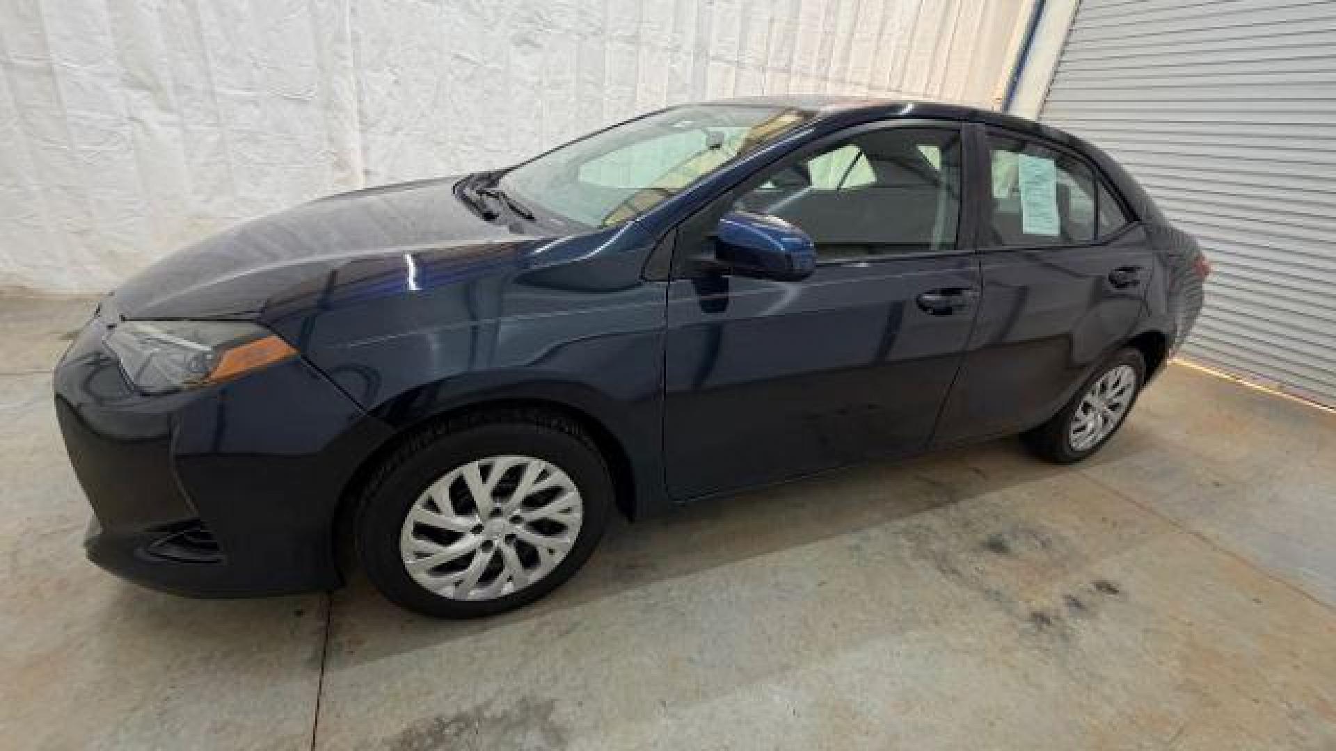 2018 Blue Toyota Corolla LE (5YFBURHE2JP) with an 1.8L I-4 DOHC engine, located at 1806 Veterans Memorial Hwy SW, Austell, GA, 30168, (770) 944-9558, 33.817959, -84.606987 - Photo#1