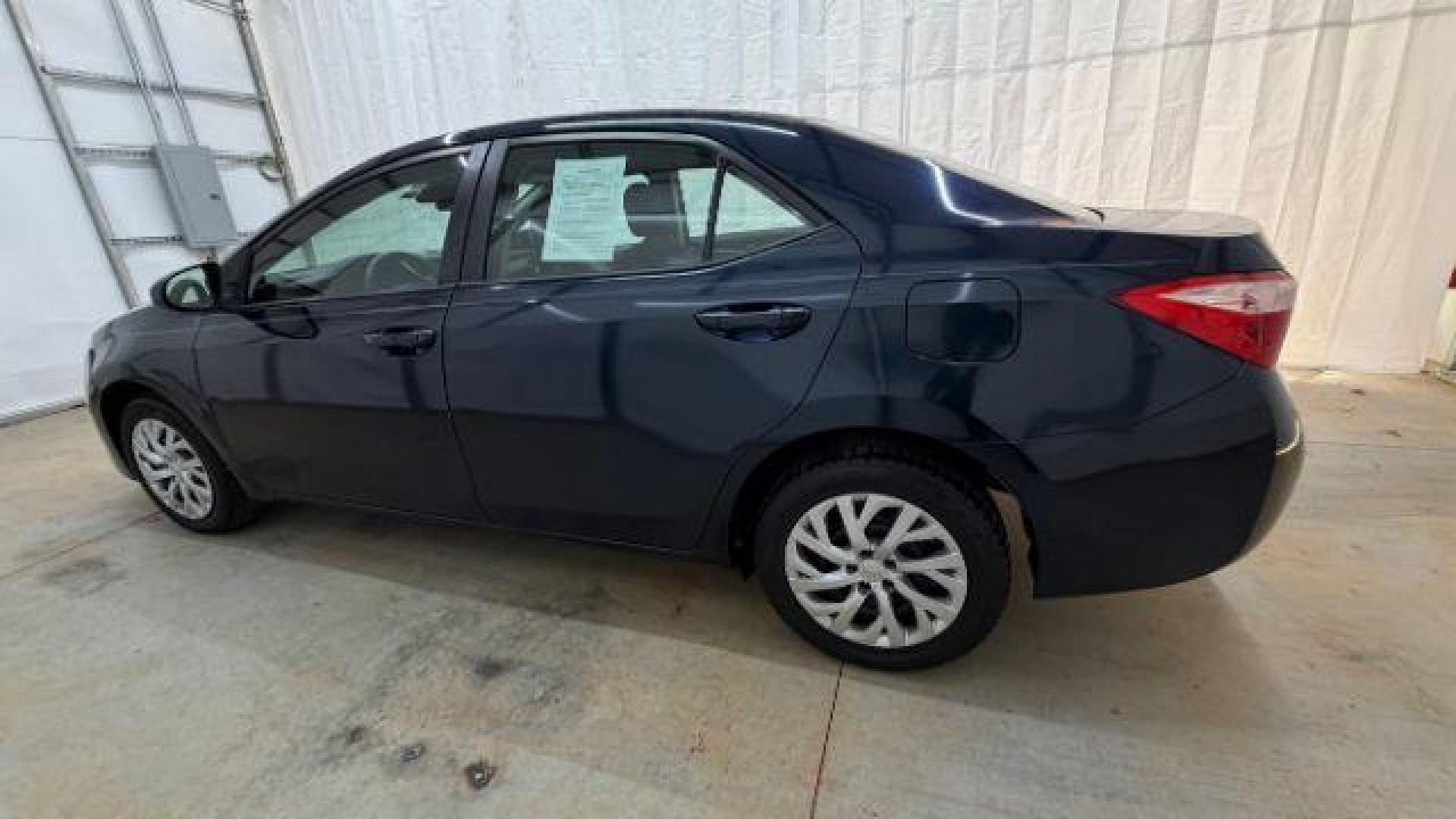 2018 Blue Toyota Corolla LE (5YFBURHE2JP) with an 1.8L I-4 DOHC engine, located at 1806 Veterans Memorial Hwy SW, Austell, GA, 30168, (770) 944-9558, 33.817959, -84.606987 - Photo#2