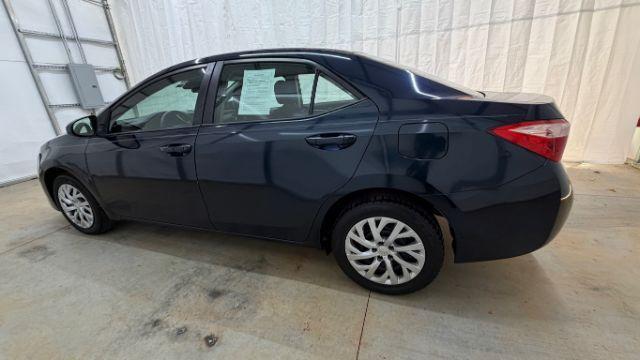 2018 Blue Toyota Corolla LE (5YFBURHE2JP) with an 1.8L I-4 DOHC engine, located at 1806 Veterans Memorial Hwy SW, Austell, GA, 30168, (770) 944-9558, 33.817959, -84.606987 - Photo#2