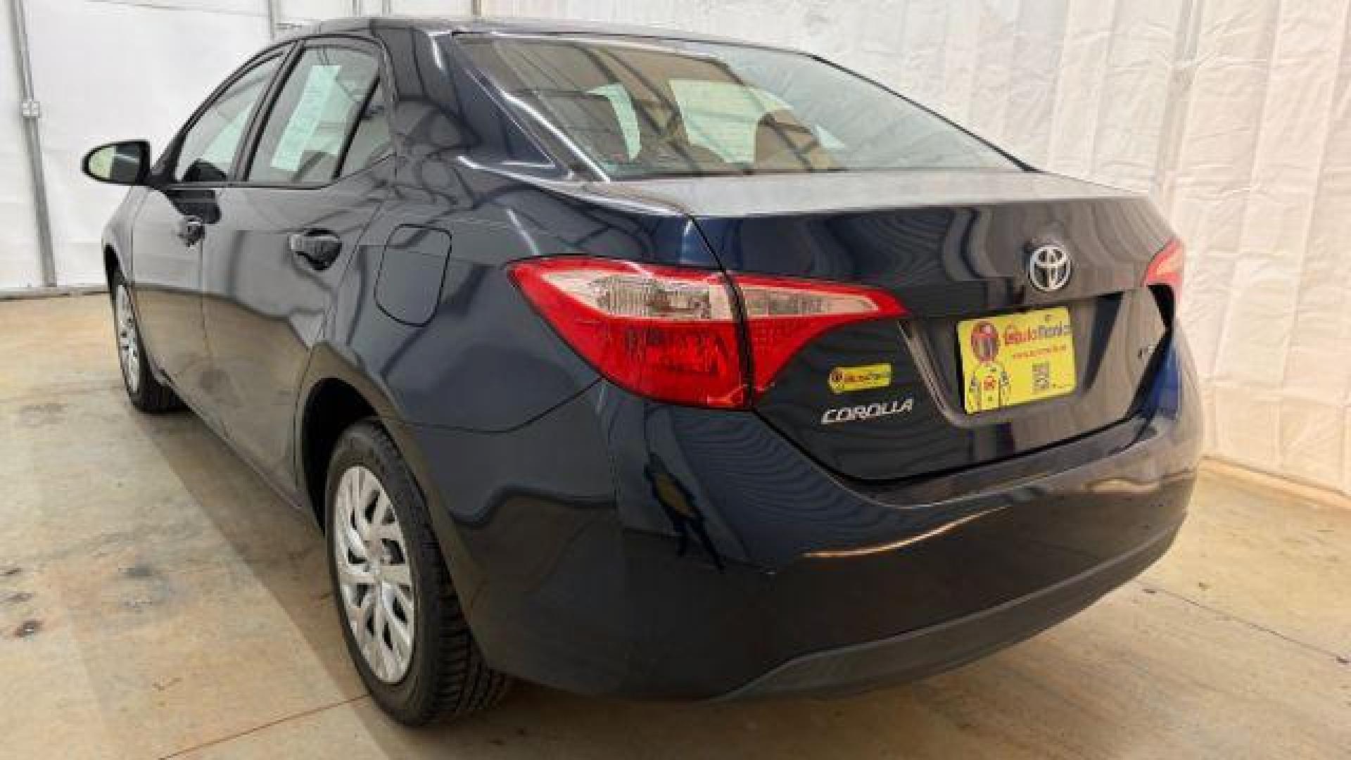 2018 Blue Toyota Corolla LE (5YFBURHE2JP) with an 1.8L I-4 DOHC engine, located at 1806 Veterans Memorial Hwy SW, Austell, GA, 30168, (770) 944-9558, 33.817959, -84.606987 - Photo#3