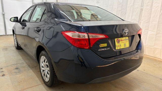 2018 Blue Toyota Corolla LE (5YFBURHE2JP) with an 1.8L I-4 DOHC engine, located at 1806 Veterans Memorial Hwy SW, Austell, GA, 30168, (770) 944-9558, 33.817959, -84.606987 - Photo#3