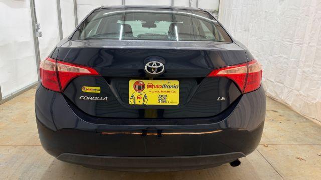 2018 Blue Toyota Corolla LE (5YFBURHE2JP) with an 1.8L I-4 DOHC engine, located at 1806 Veterans Memorial Hwy SW, Austell, GA, 30168, (770) 944-9558, 33.817959, -84.606987 - Photo#4
