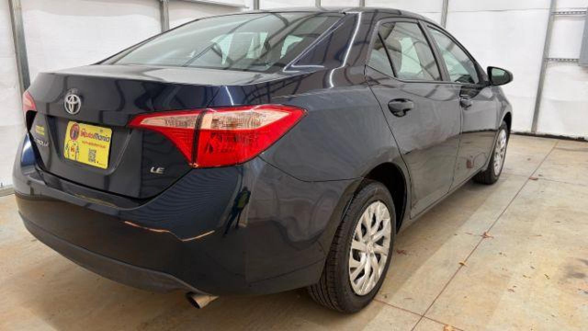 2018 Blue Toyota Corolla LE (5YFBURHE2JP) with an 1.8L I-4 DOHC engine, located at 1806 Veterans Memorial Hwy SW, Austell, GA, 30168, (770) 944-9558, 33.817959, -84.606987 - Photo#5